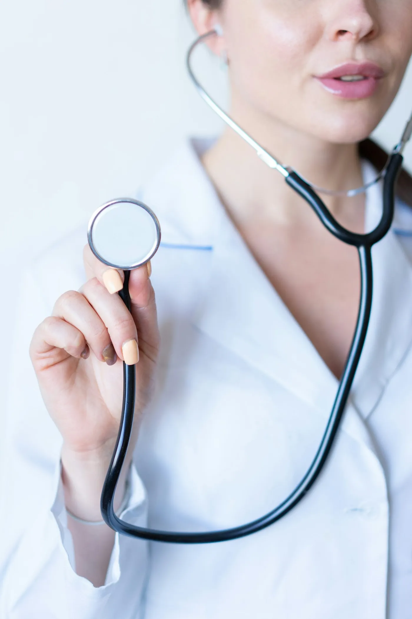 Clinician with a stethoscope, representing careers at CaRiMed